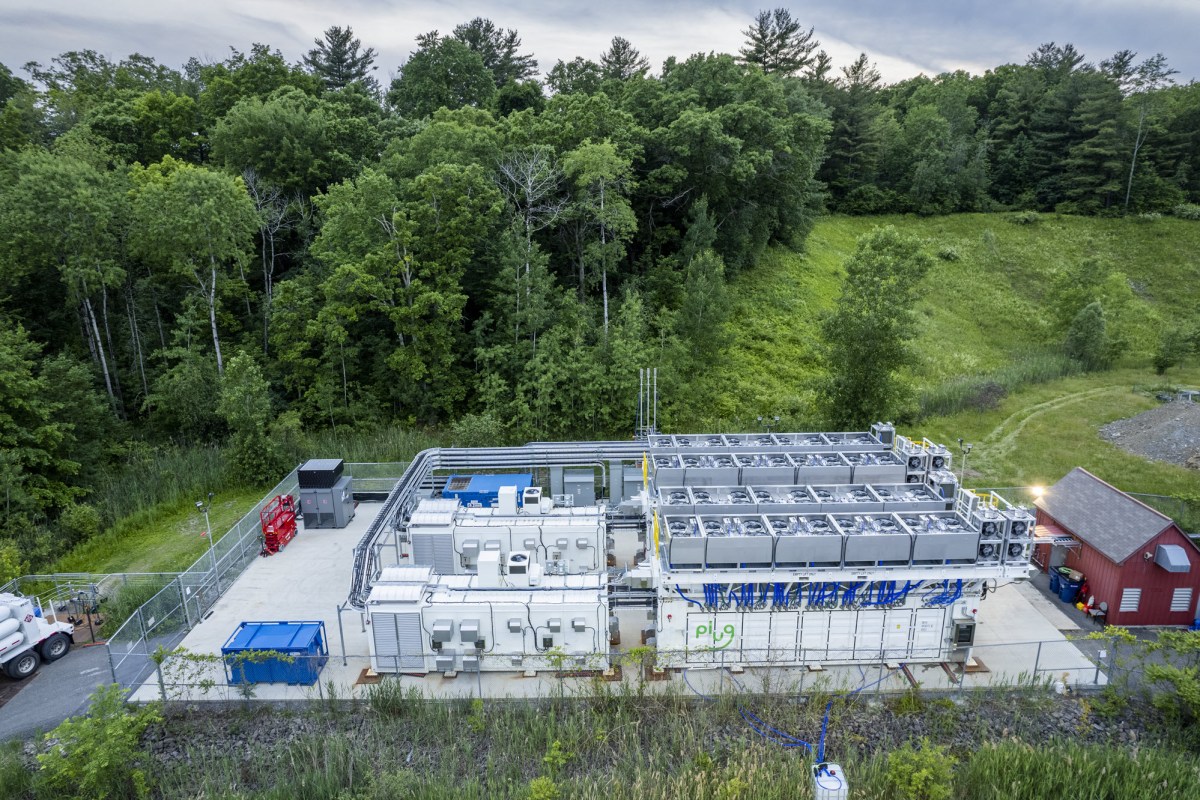 Steam is seen venting from pipes at the top of the shipping containers during a test of the three-megawatt fuel cell system. PEM fuel cells combine hydrogen and oxygen in a chemical reaction that generates electricity, heat and water. While most of the water drains out in liquid form, a portion vents out as steam.